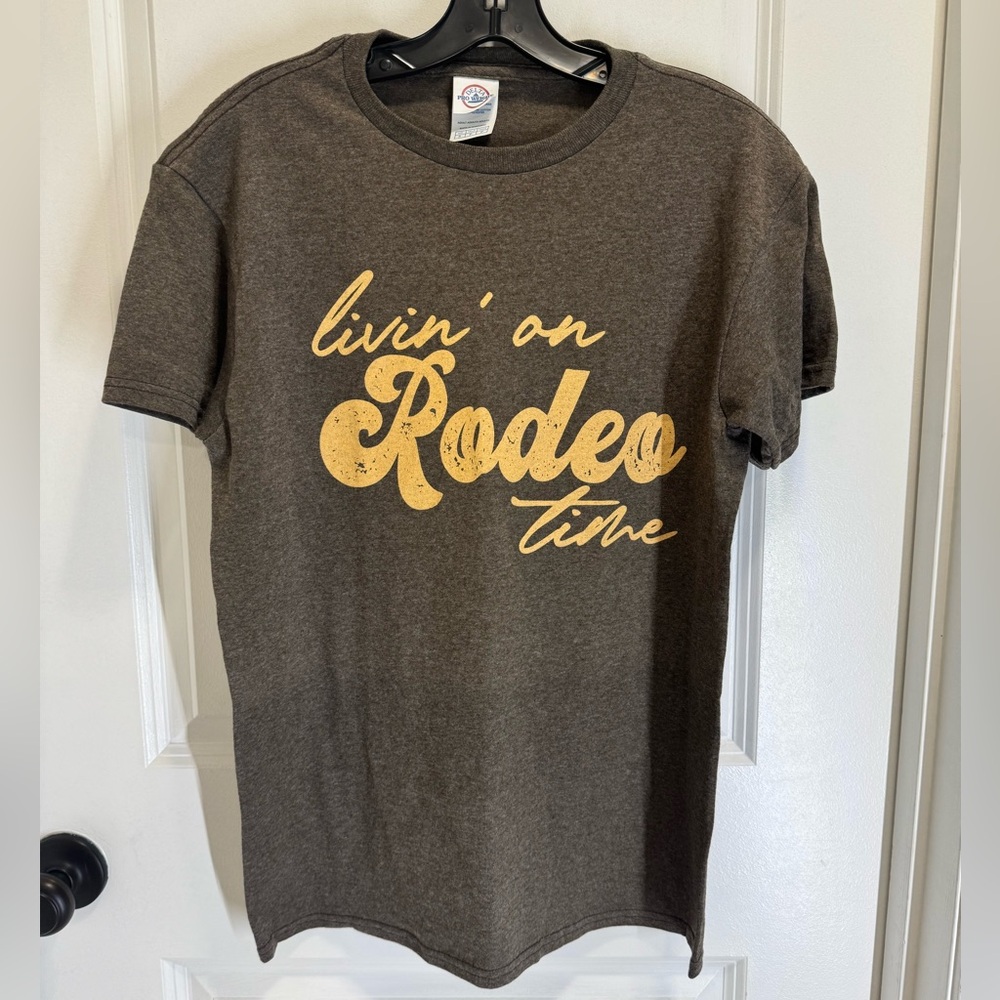 Brown T-Shirt with Yellow Graphic “Livin’ on Rodeo Time”